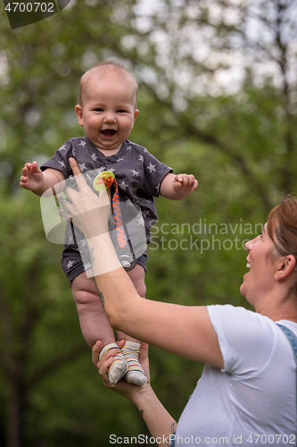 Image of woman with baby  in nature