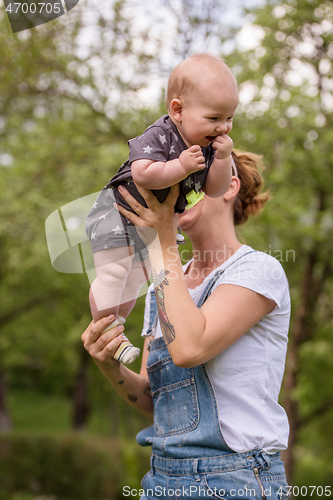 Image of woman with baby  in nature