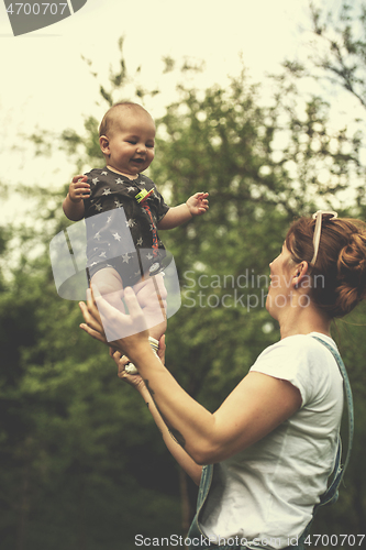 Image of woman with baby  in nature