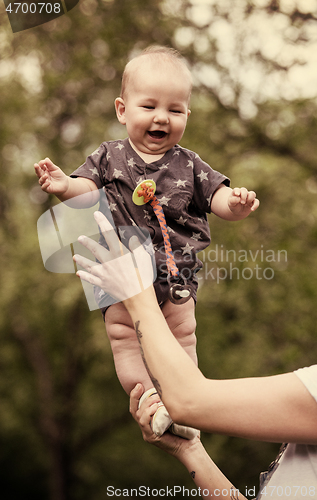 Image of woman with baby  in nature