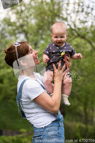 Image of woman with baby  in nature