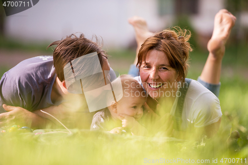 Image of hipster family relaxing in park