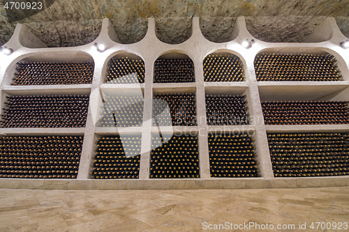 Image of Wine bottle wall in winery