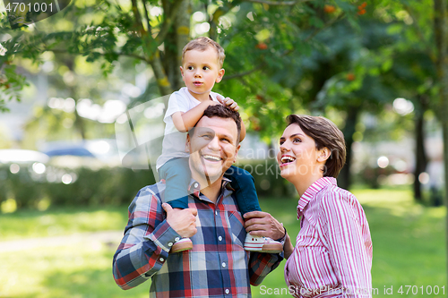 Image of happy family having fun at summer park