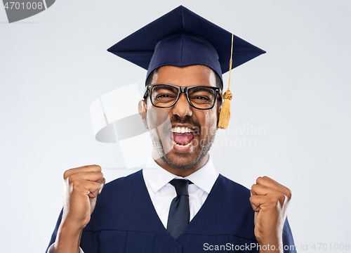 Image of happy indian graduate student celebrating success