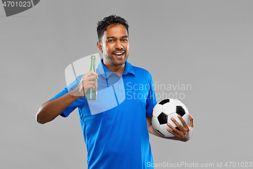 Image of football fan with soccer ball celebrating victory