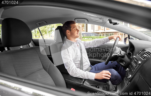 Image of man or driver driving car