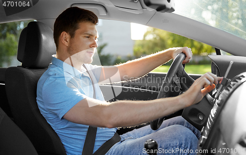 Image of man or driver driving car and using gps navigator