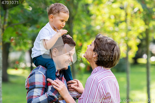 Image of happy family having fun at summer park