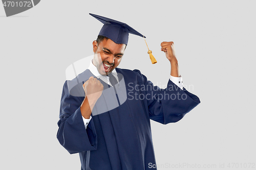 Image of happy indian graduate student in mortar board