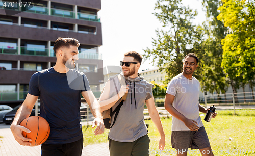 Image of group of male friends going to play basketball