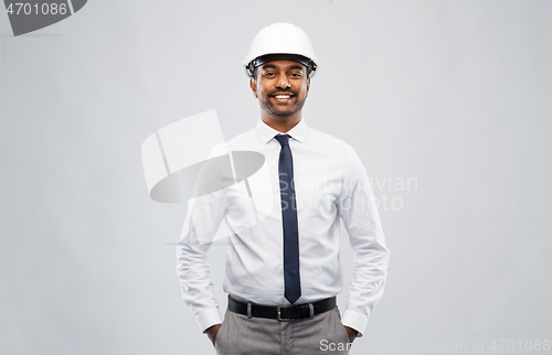 Image of indian male architect in helmet over grey