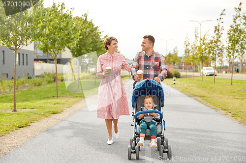 Image of family with baby in stroller and coffee in city