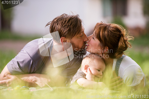 Image of hipster family relaxing in park