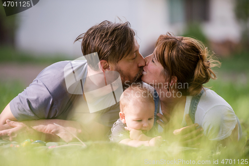 Image of hipster family relaxing in park