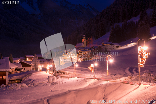 Image of mountain village in alps  at night