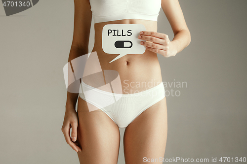 Image of Woman health. Female model holding card