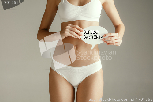 Image of Woman health. Female model holding card