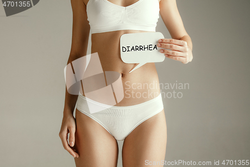 Image of Woman health. Female model holding card