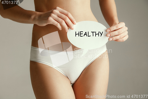 Image of Women belly with the drawing word HEALTH