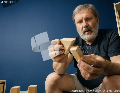 Image of Old bearded man with alzheimer desease