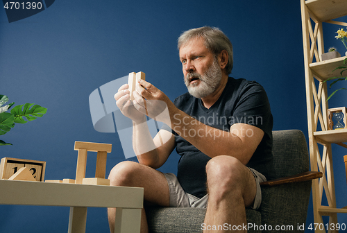 Image of Old bearded man with alzheimer desease