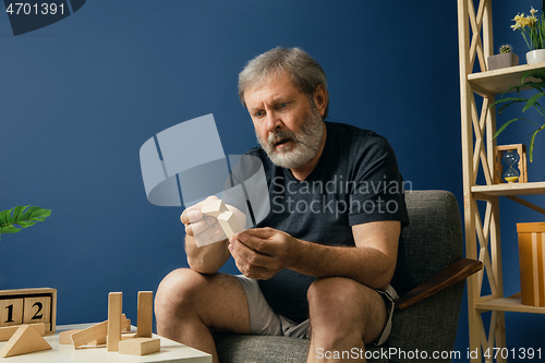 Image of Old bearded man with alzheimer desease