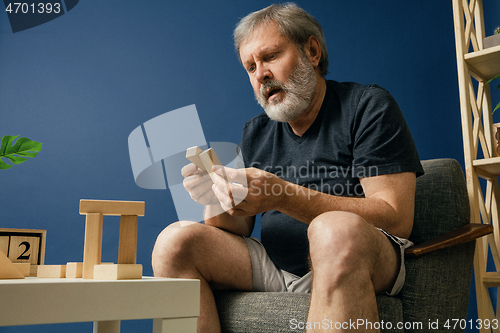 Image of Old bearded man with alzheimer desease