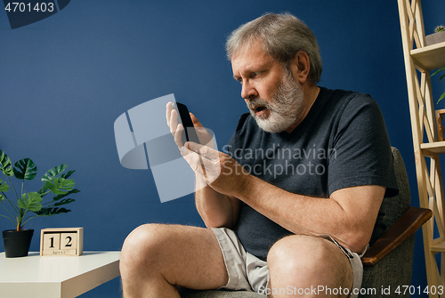 Image of Old bearded man with alzheimer desease