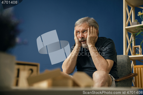 Image of Old bearded man with alzheimer desease