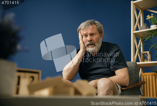 Image of Old bearded man with alzheimer desease