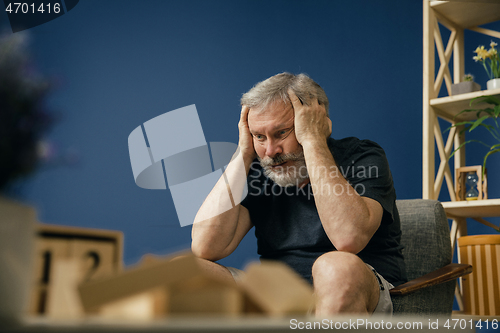 Image of Old bearded man with alzheimer desease