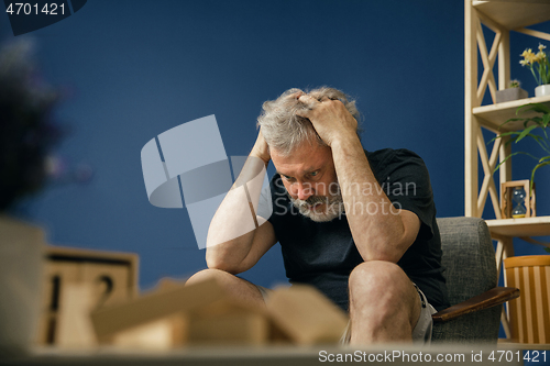 Image of Old bearded man with alzheimer desease