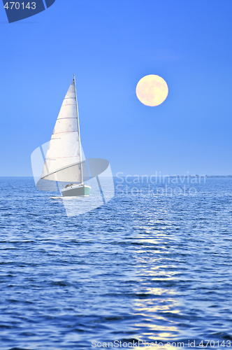 Image of Sailboat at full moon