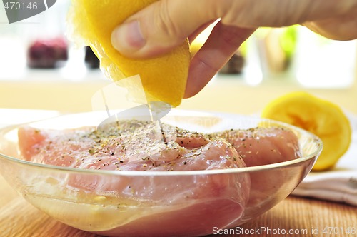 Image of Raw chicken breasts marinating