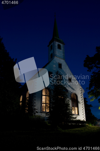 Image of Small white church in evening