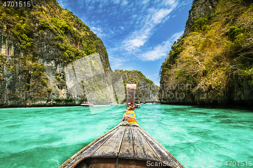 Image of Traditional wooden boat in a picture perfect tropical bay on Koh Phi Phi Island, Thailand, Asia