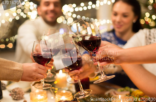 Image of close up of friends with wine celebrate christmas