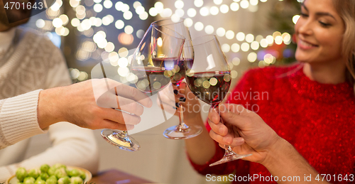 Image of close up of friends with wine celebrate christmas