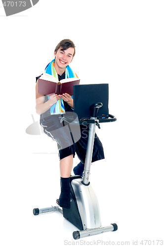 Image of Young boy doing fitness and studying