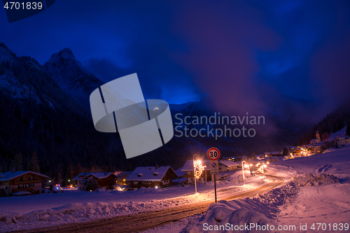 Image of mountain village in alps  at night