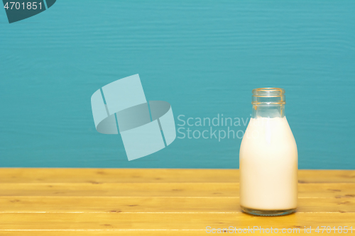 Image of Fresh creamy milk in a one-third pint glass bottle