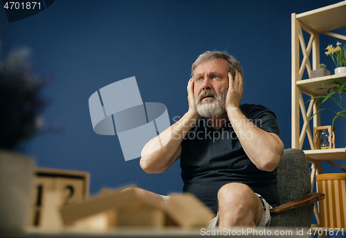 Image of Old bearded man with alzheimer desease