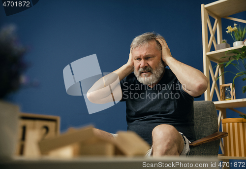 Image of Old bearded man with alzheimer desease