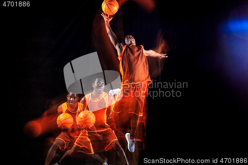 Image of Young basketball player against dark background