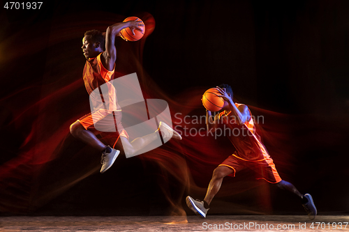 Image of Young basketball player against dark background