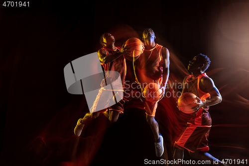 Image of Young basketball player against dark background