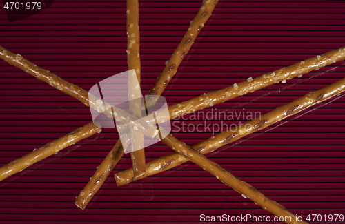 Image of salt sticks on dark ground