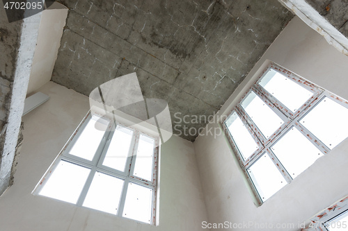 Image of Second light in a two-level apartment from the developer, bare walls with plastic windows