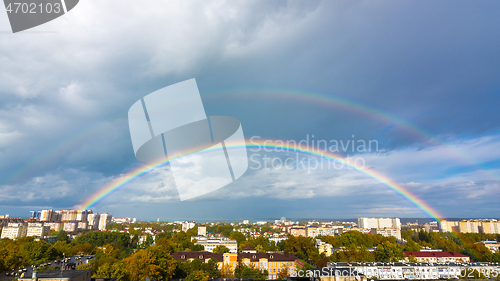 Image of Double rainbow in the sky over the roofs of the resort city of Anapa, Russia